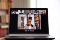 Device screen with a woman hosting a video conference