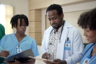 A Black doctor teaching Black medical students