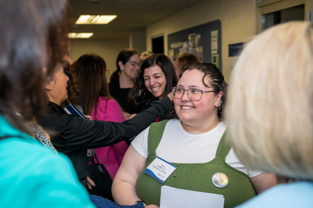 Hood College student Anna LePlatt greets guests at the opening of the Data Driven Frederick Center