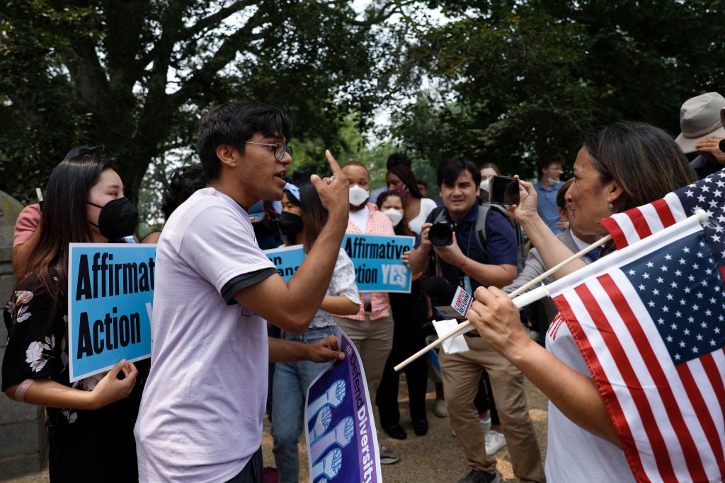 Demonstrators gather and argue near the Supreme Court