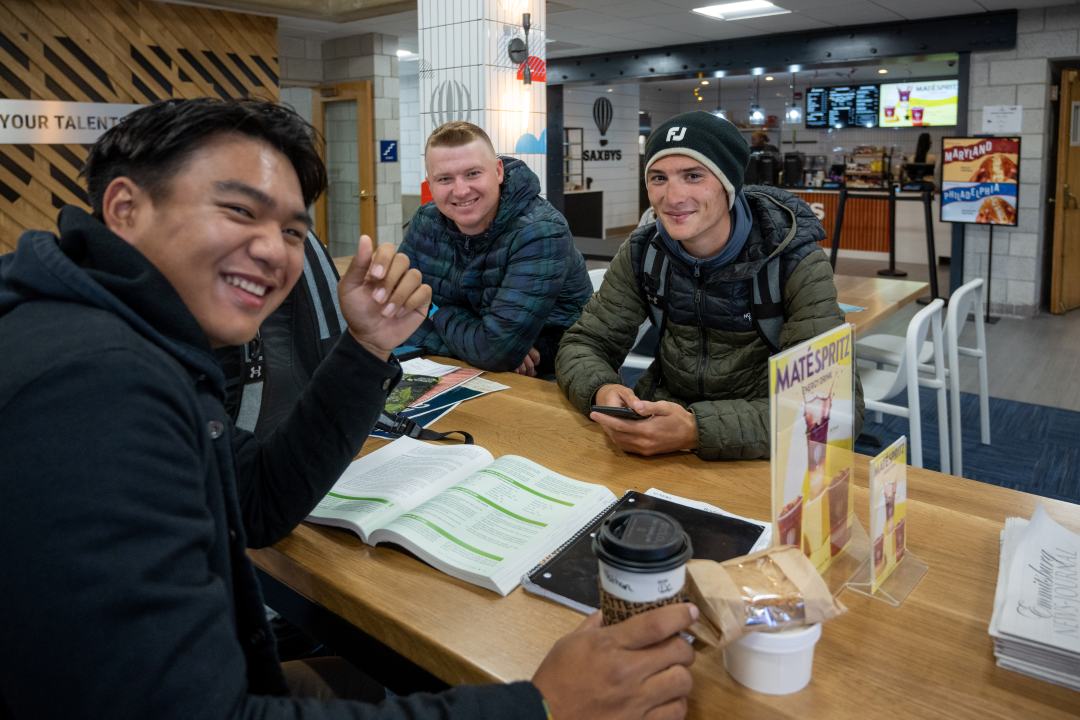 Students smile in front of the Saxbys cafe at Mount St. Mary’s University