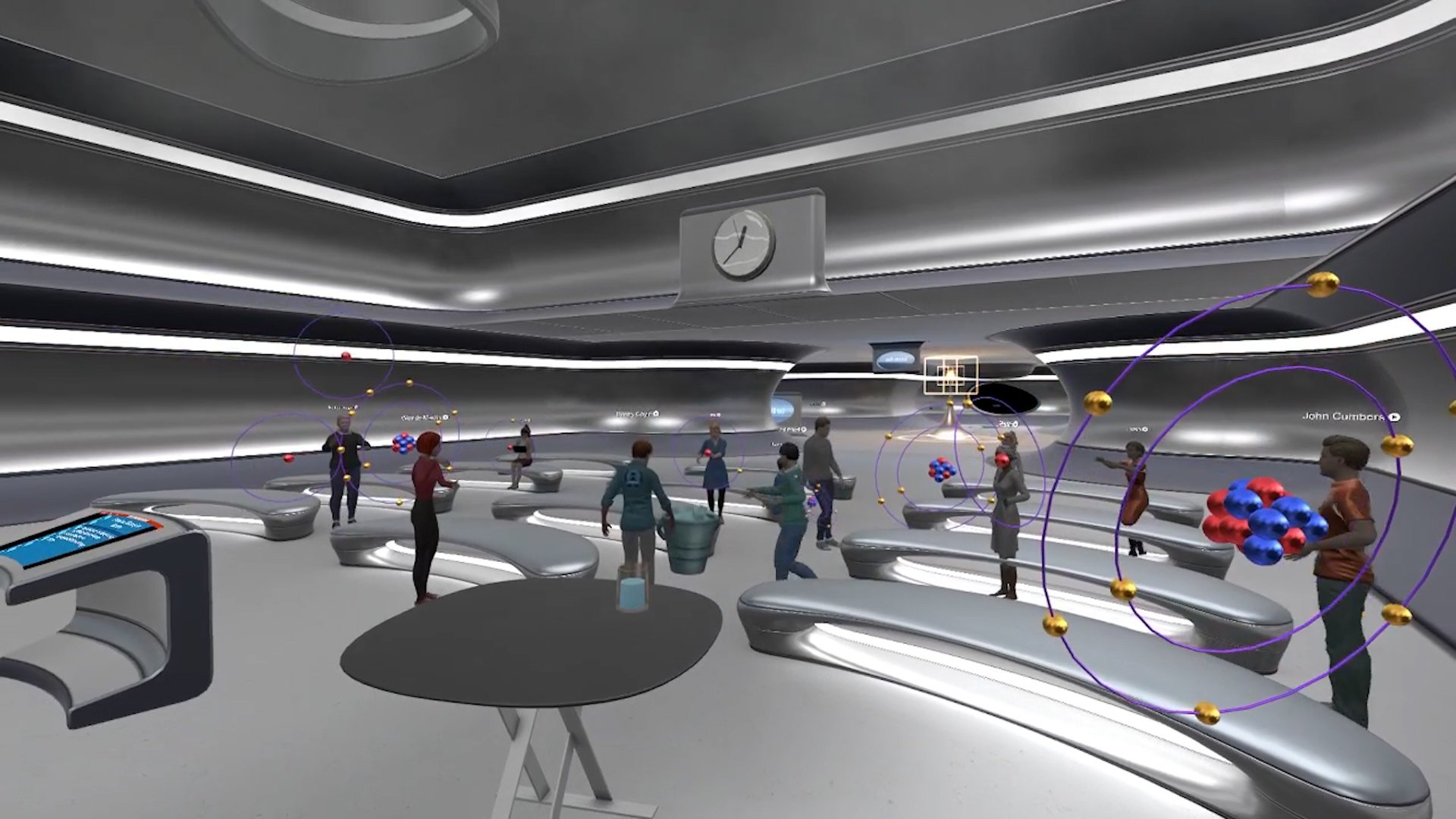 Student in a futuristic classroom look at atoms in the metaverse as part of a chemistry course.