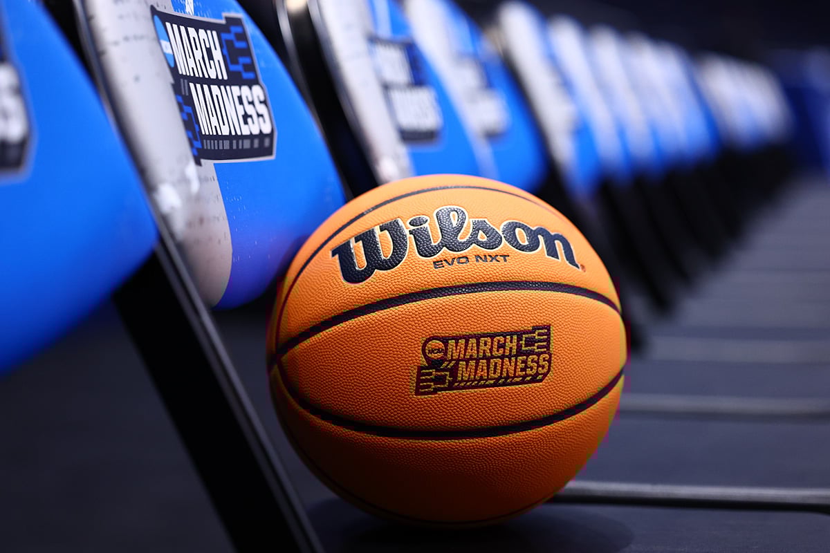 A basketball with the 2025 NCAA March Madness logo sits on a chair.