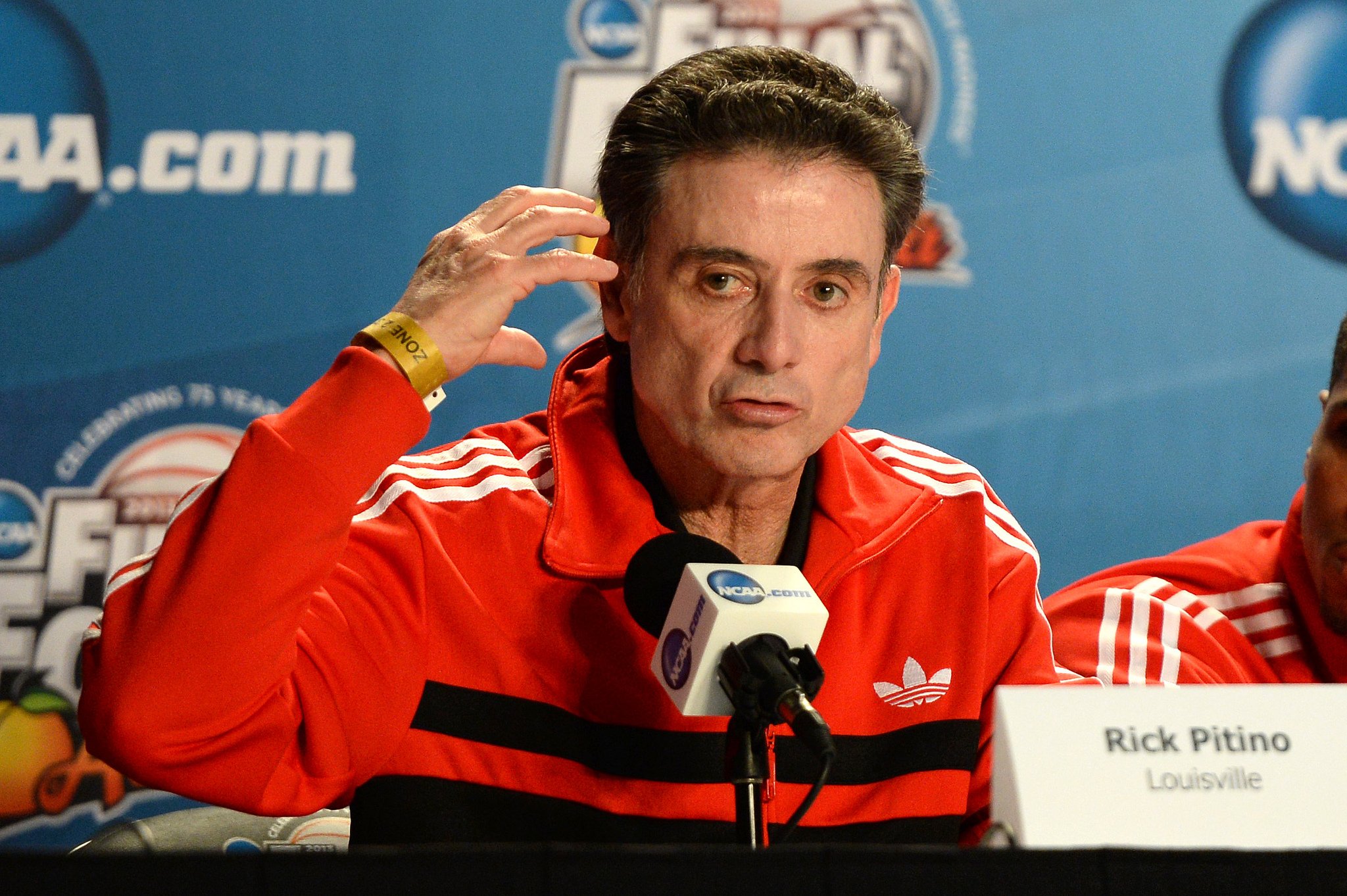 Louisville basketball coach suspended for five games for prostitution scandal in program