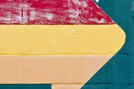 A red and yellow arrow logo made by Campus Pride