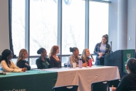 A group of women students speaking on a panel at Manhattan College.