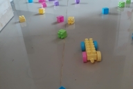 Colorful blocks scattered across a carpetless floor