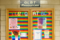 A rainbow-covered board at BC advertising LGBTQ+ resources