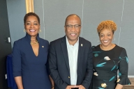 Harry Williams, CEO of TMCF, stands with Patricia Sims, president of Drake State Community & Technical College, and Kemba Chambers, president of Trenholm State Community College. All three Black leaders are smiling.