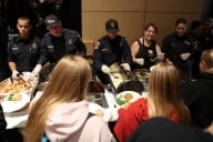 Cal Fire firefighters serve Camp Fire evacuees during a community Thanksgiving dinner at California State University, Chico 