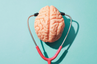 An image of a stethoscope and a human brain, depicting the concept of mental health.