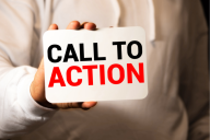 A close-up of a hand holding a sign that reads "Call to Action."