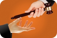 Two hands handing off a gavel on an orange background.