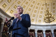 House Speaker Kevin McCarthy stands at a microphone at the Capitol