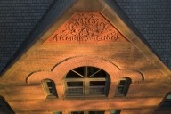 A high-angle shot of a brick building engraved with the words "YMCA Training School."