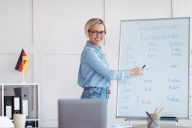 A photograph of a teacher teaching German. 