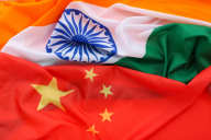 The flags of China and India, unfurled next to one another.