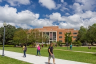 Students walk around Robert Manning Strozier Library at Florida State University
