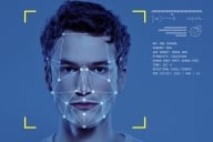 Facial portrait of a young man with a network of lines on his face intended to depict ingredients for a facial recognition scan.