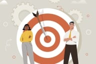 Black woman and white man with arms crossed stand in front of an arrow in a bull's-eye