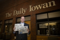 Jason Brummond holds copies of the Solon Economist and the Mount Vernon-Lisbon Sun.
