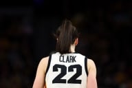 A photo of the back of Caitlin Clark wearing her University of Iowa basketball jersey