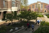 People walk on Drury University’s campus on a sunny day