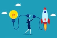 Woman plugs a lightbulb into a rocket ship taking off