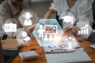 Concept image with work- and college-related white icons over a background of two students talking.