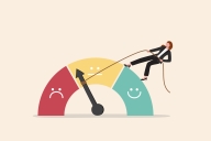 An illustration of a gauge indicating three levels of satisfaction—a red section with a frowning face, a yellow section with a neutral face, and a teal level with a smiling face. The needle points to the low end of the yellow, neutral range. A female standing atop the gauge has lassoed the needle with a rope and appears to be attempting to pull it toward the smiling, positive side of the gauge.