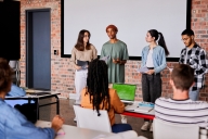 Group of students giving a presentation to classmates