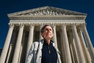Man in front of Supreme Court building