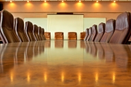 A photo of an empty boardroom table.
