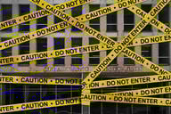 The Education Department building with caution tape on it