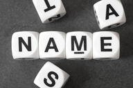The word "name" is spelled out on cubes.