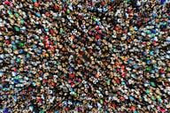 A photo of a large crowd of people gathered in one place, taken from overhead with a drone.