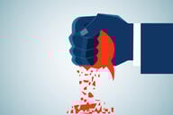 An illustration of a human hand squashing a red speech bubble in its fist.