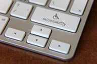 Accessibility computer icon on a keyboard of a laptop