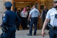 Pro-Palestinian protesters are escorted out of Columbia University's Butler Library.