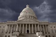 A photo of the U.S. Capitol building against a dark sky. 