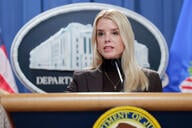 U.S. Attorney General Pam Bondi speaks at a podium.