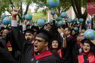 Students with caps and gowns and globes