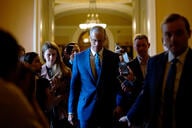 Senate Majority Leader John Thune (R-SD) speaks to reporters as returns to his office.