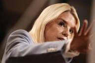 US Attorney General Pam Bondi, a blonde white woman wearing a blue blazer.