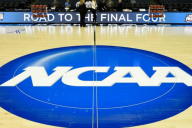 Basketball court with NCAA logo at halfcourt