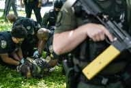 A photo of a protestor being arrested at Emory University.