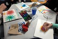 Students practice mindfulness techniques while painting with watercolors