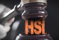 A gavel coming down on the letters "HSI" breaking and cracking them. 