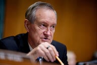 Sen. Mike Crapo holds a pencil