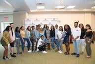 A group of Upward Bound students pose and smile at Montgomery County Community College
